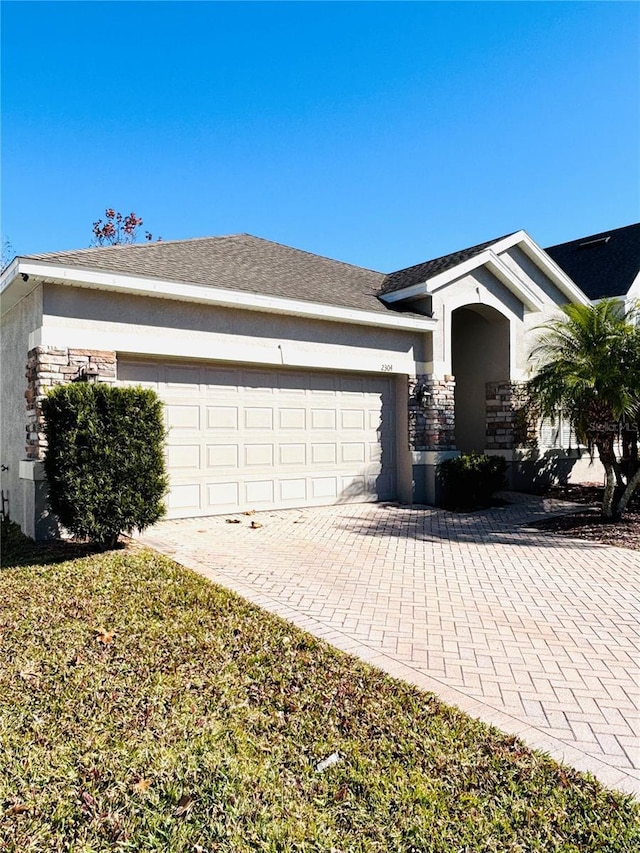 ranch-style house featuring a garage