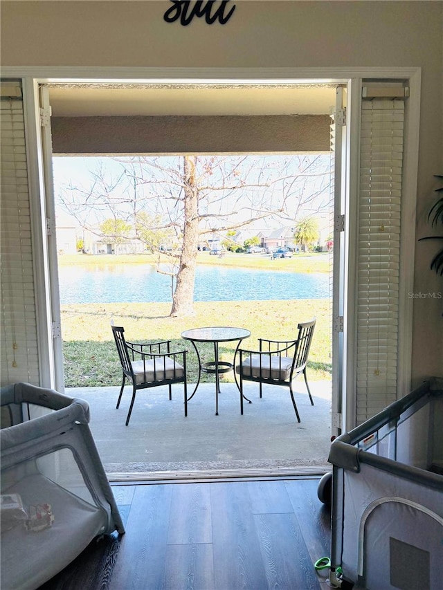 view of patio with a water view