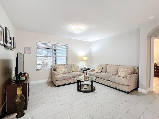 living room with a textured ceiling