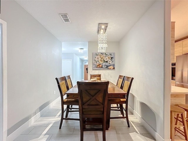 dining space with light tile patterned flooring