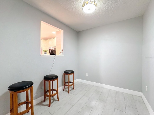 spare room featuring a textured ceiling