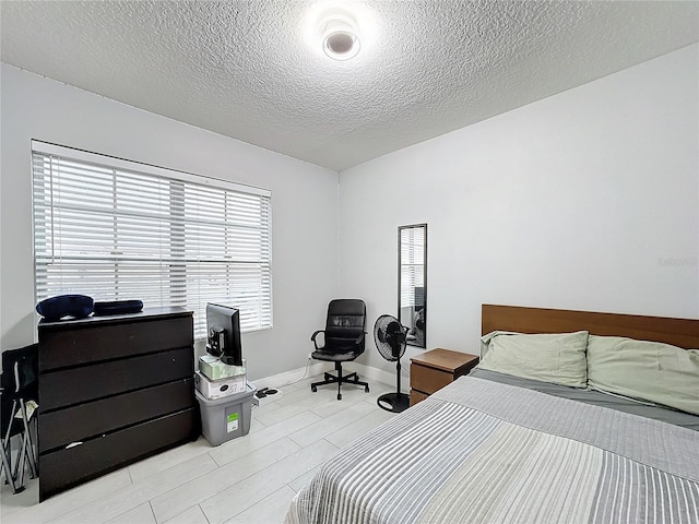 bedroom featuring a textured ceiling