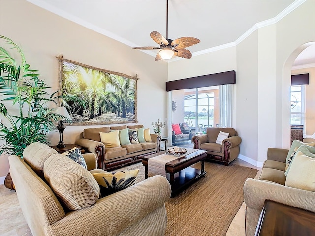 living room with crown molding and ceiling fan