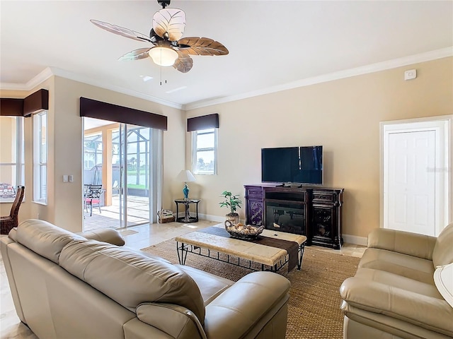 living room with ceiling fan, light tile patterned floors, ornamental molding, and a fireplace