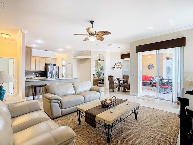 living room featuring ceiling fan and crown molding