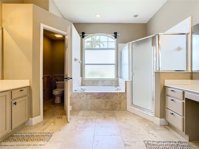 full bathroom with toilet, vanity, and separate shower and tub