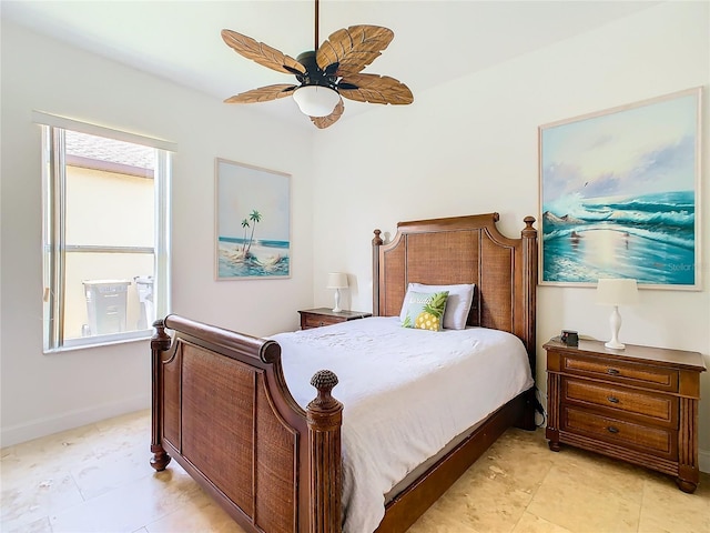 bedroom with multiple windows and ceiling fan