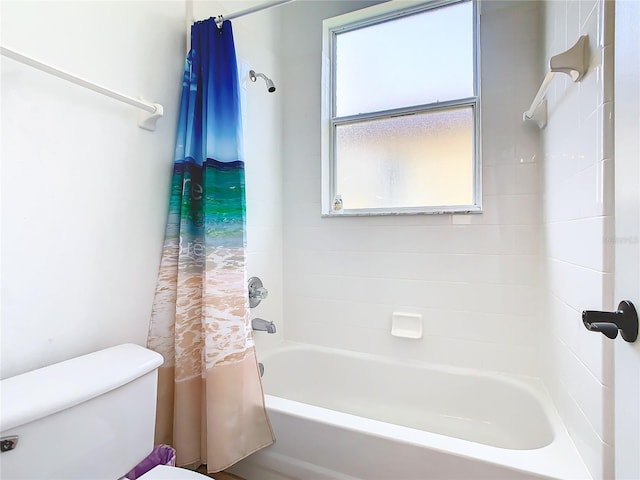 bathroom with toilet, a wealth of natural light, and shower / bath combo