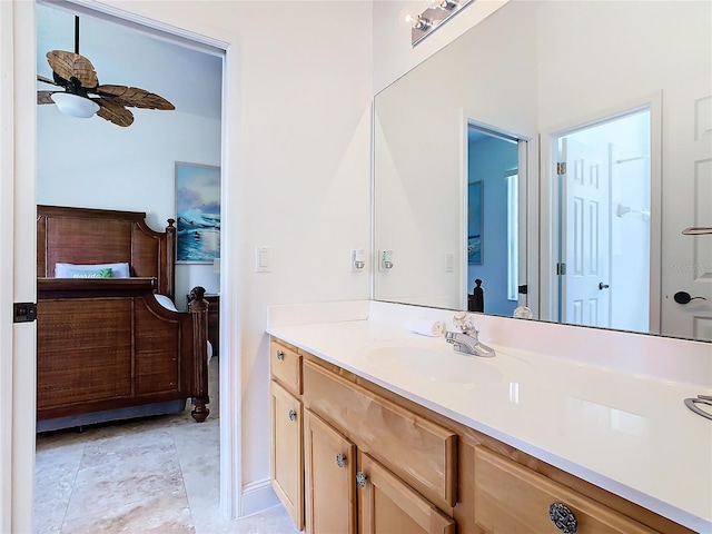 bathroom with ceiling fan and vanity