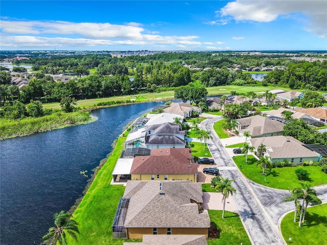 birds eye view of property with a water view