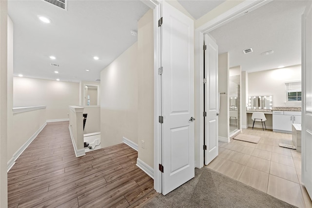 hall with light wood-type flooring