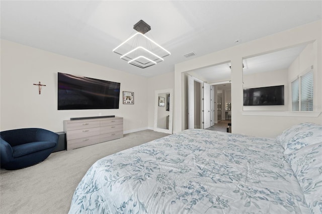 bedroom featuring a chandelier and carpet flooring