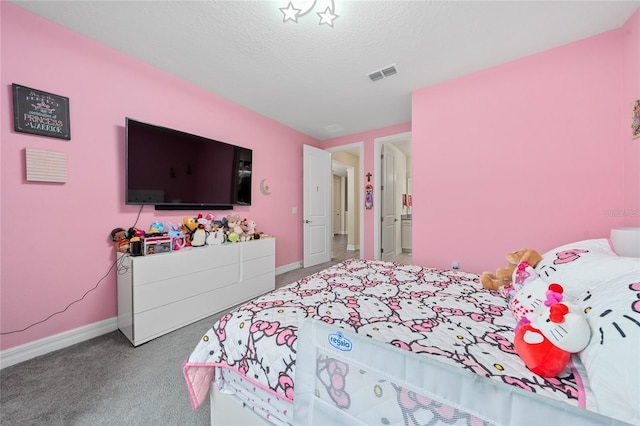 bedroom with carpet and a textured ceiling