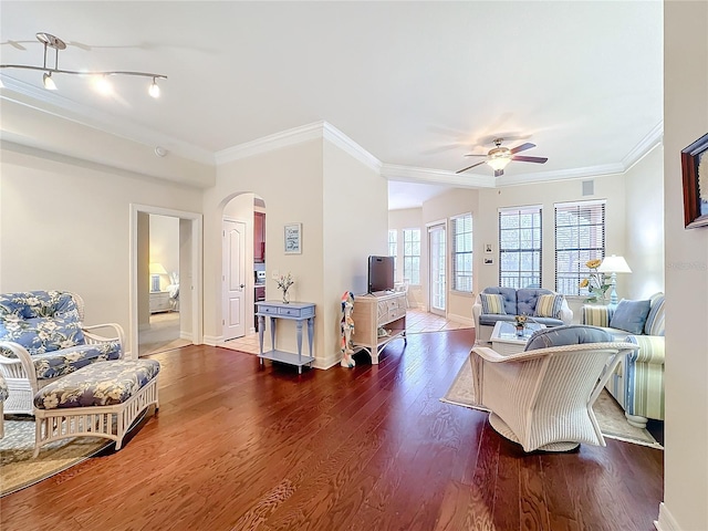 living room featuring ornamental molding, dark hardwood / wood-style floors, and ceiling fan