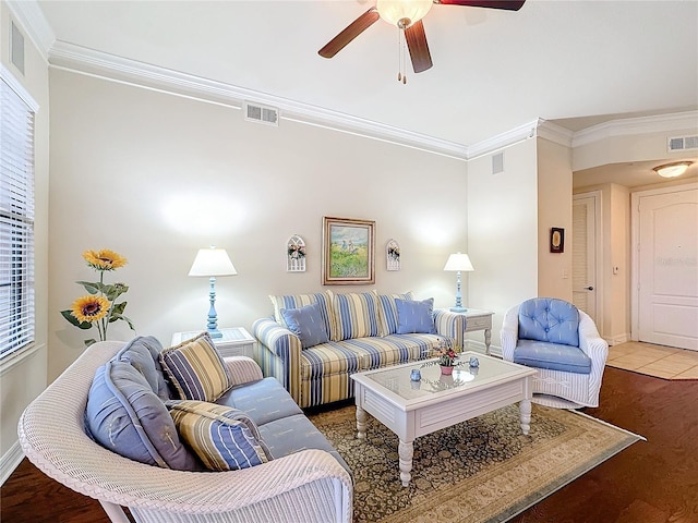 living room featuring ornamental molding, dark hardwood / wood-style floors, and ceiling fan