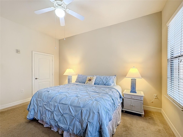 bedroom with multiple windows, carpet flooring, and ceiling fan