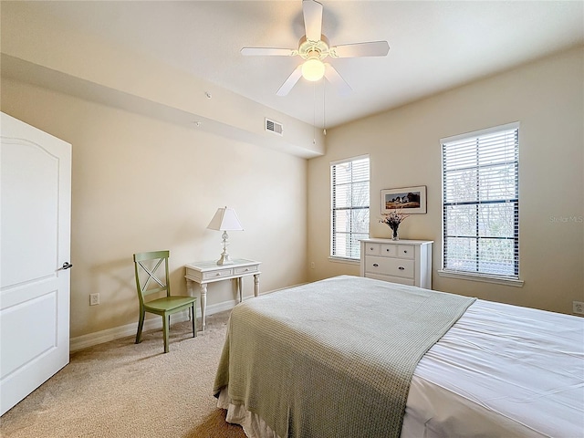 bedroom featuring ceiling fan and light colored carpet