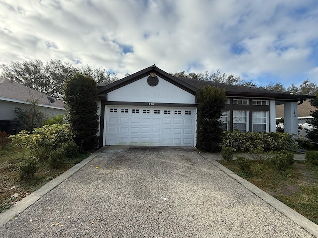 garage featuring driveway