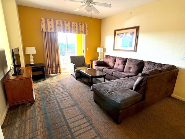 8100 Poinciana Blvd Unit 2703, Orlando, FL 32821 - living room with ceiling fan and dark carpet