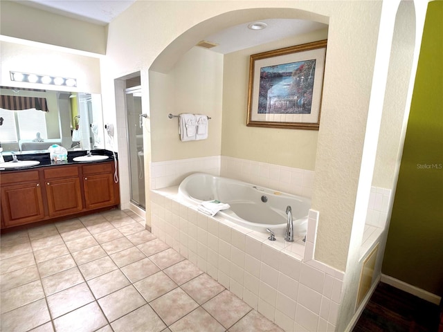 8100 Poinciana Blvd Unit 2703, Orlando, FL 32821 - bathroom featuring vanity, plus walk in shower, and tile patterned flooring