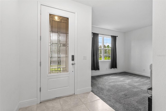 entryway featuring light carpet