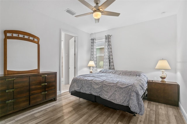 bedroom featuring light hardwood / wood-style floors and ceiling fan