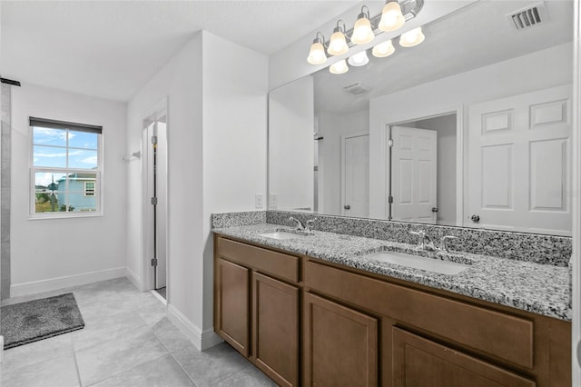 bathroom featuring vanity and tile patterned flooring