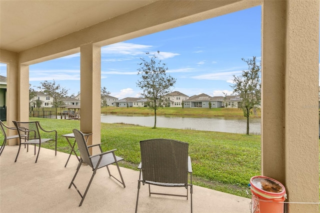 view of patio / terrace with a water view