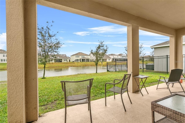 view of patio featuring a water view