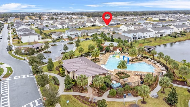 birds eye view of property featuring a water view