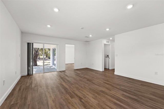 spare room featuring dark hardwood / wood-style flooring