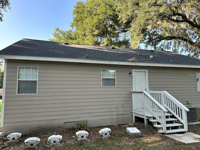 rear view of property with central air condition unit