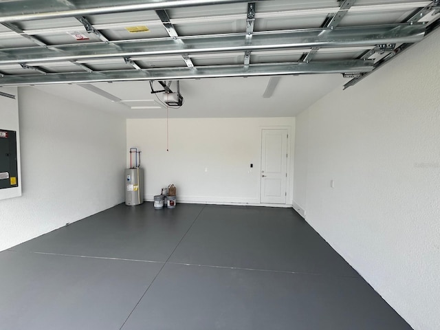 garage featuring a garage door opener and electric water heater