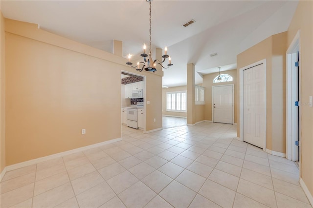 interior space featuring light tile patterned flooring and an inviting chandelier