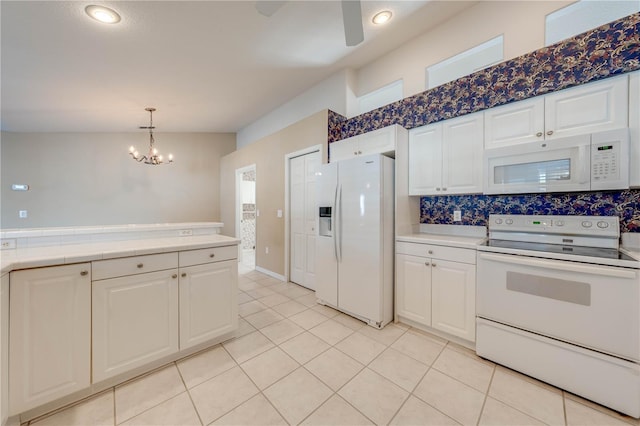 kitchen featuring white cabinetry, decorative light fixtures, light tile patterned floors, white appliances, and decorative backsplash