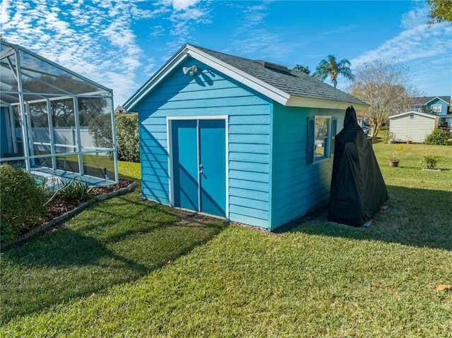 view of outdoor structure featuring a yard