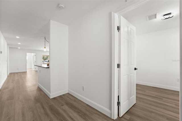 hall featuring wood-type flooring