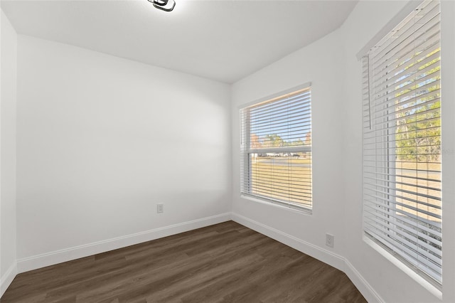 spare room featuring dark hardwood / wood-style flooring