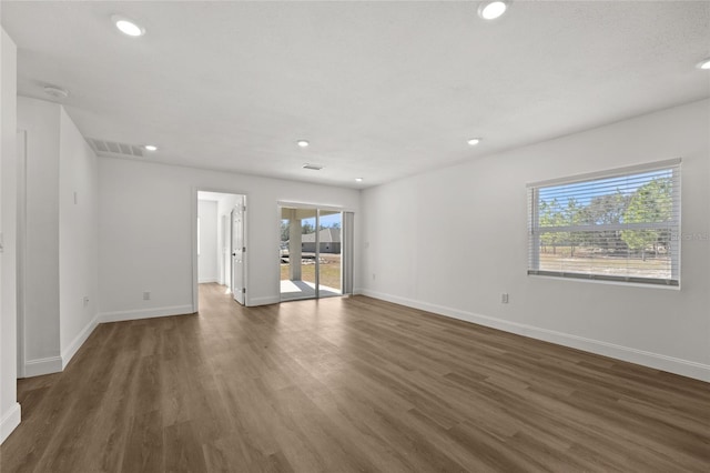 unfurnished room with dark hardwood / wood-style floors