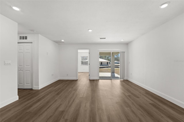 unfurnished room with dark hardwood / wood-style floors