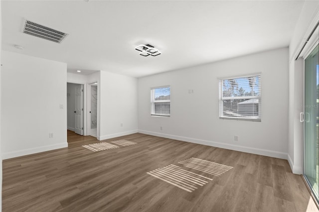 spare room with hardwood / wood-style floors