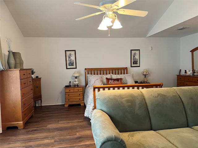 bedroom featuring vaulted ceiling, dark wood-type flooring, and ceiling fan