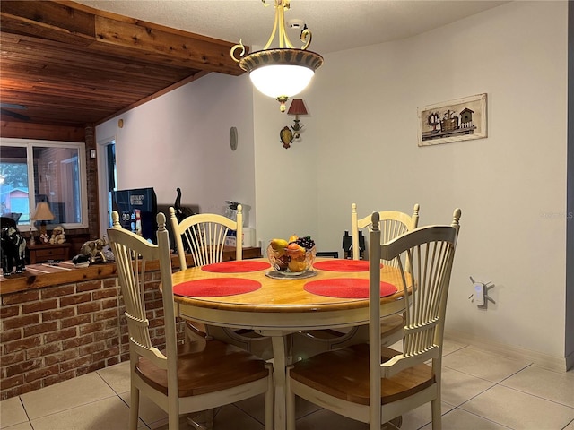 dining room featuring wooden ceiling and light tile patterned flooring