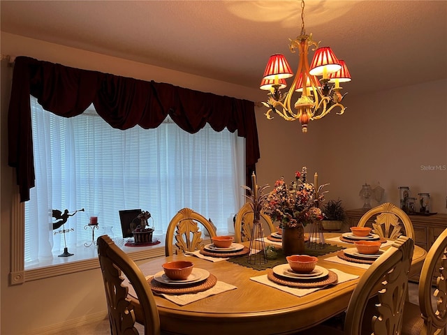 dining area featuring an inviting chandelier