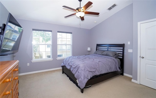 bedroom featuring ceiling fan, light colored carpet, and lofted ceiling