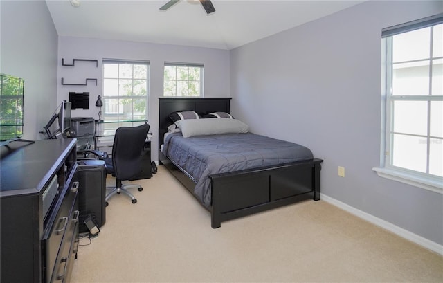 bedroom featuring ceiling fan and light carpet