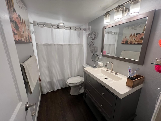 full bathroom with shower / bath combination with curtain, wood-type flooring, toilet, and vanity