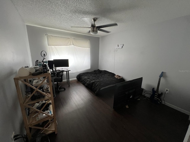 bedroom featuring wood-type flooring, ceiling fan, and a textured ceiling