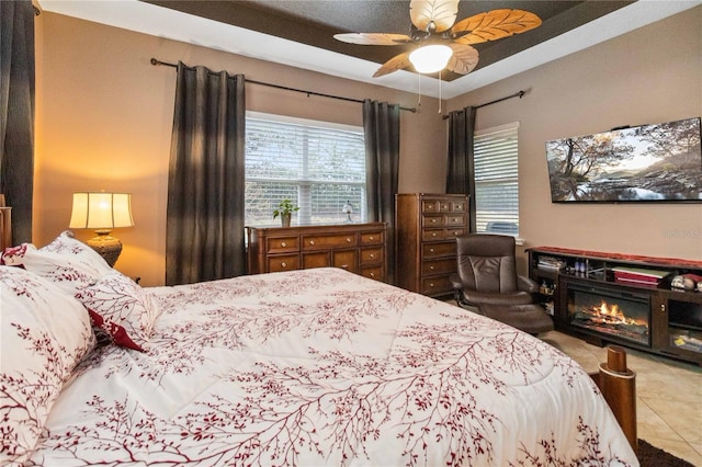 bedroom with tile patterned flooring and ceiling fan