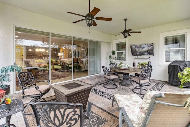 view of patio / terrace featuring a grill, a fire pit, and ceiling fan